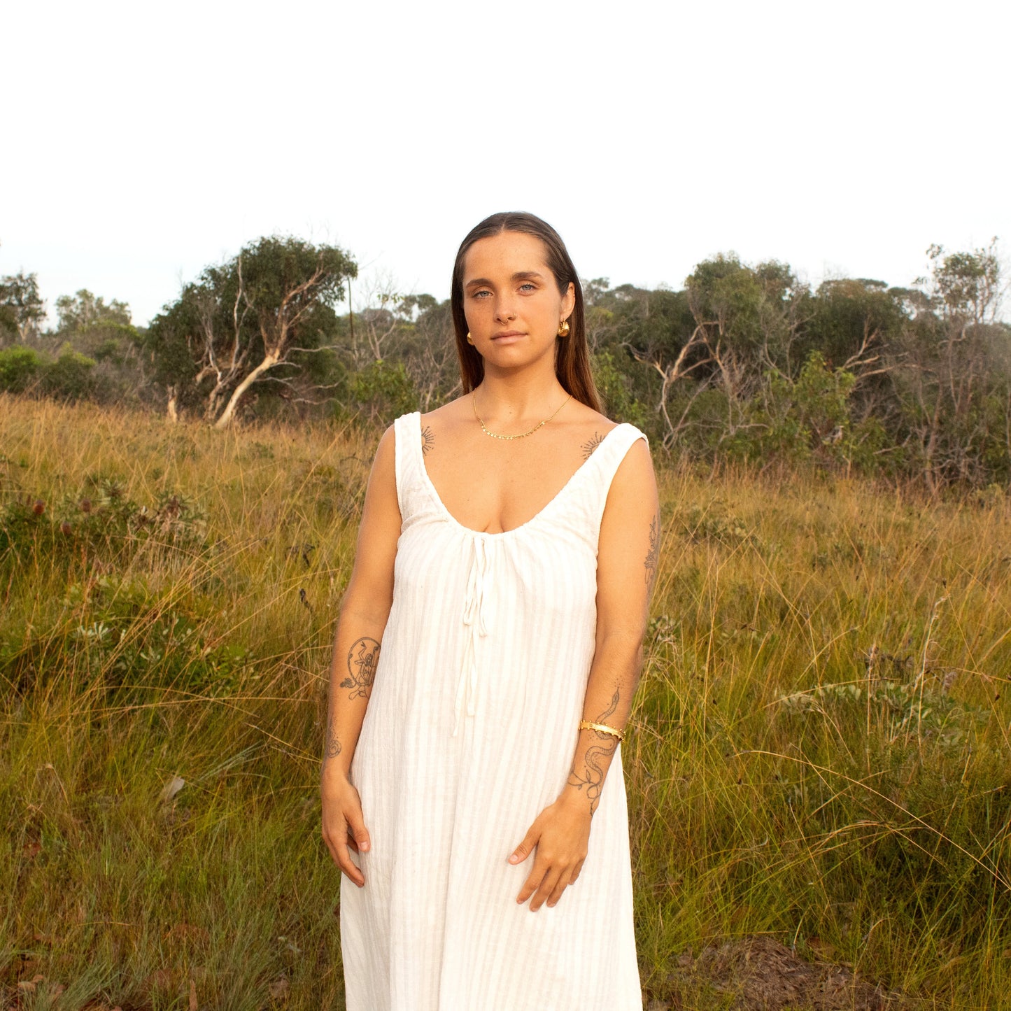 Woman in white dress in a field