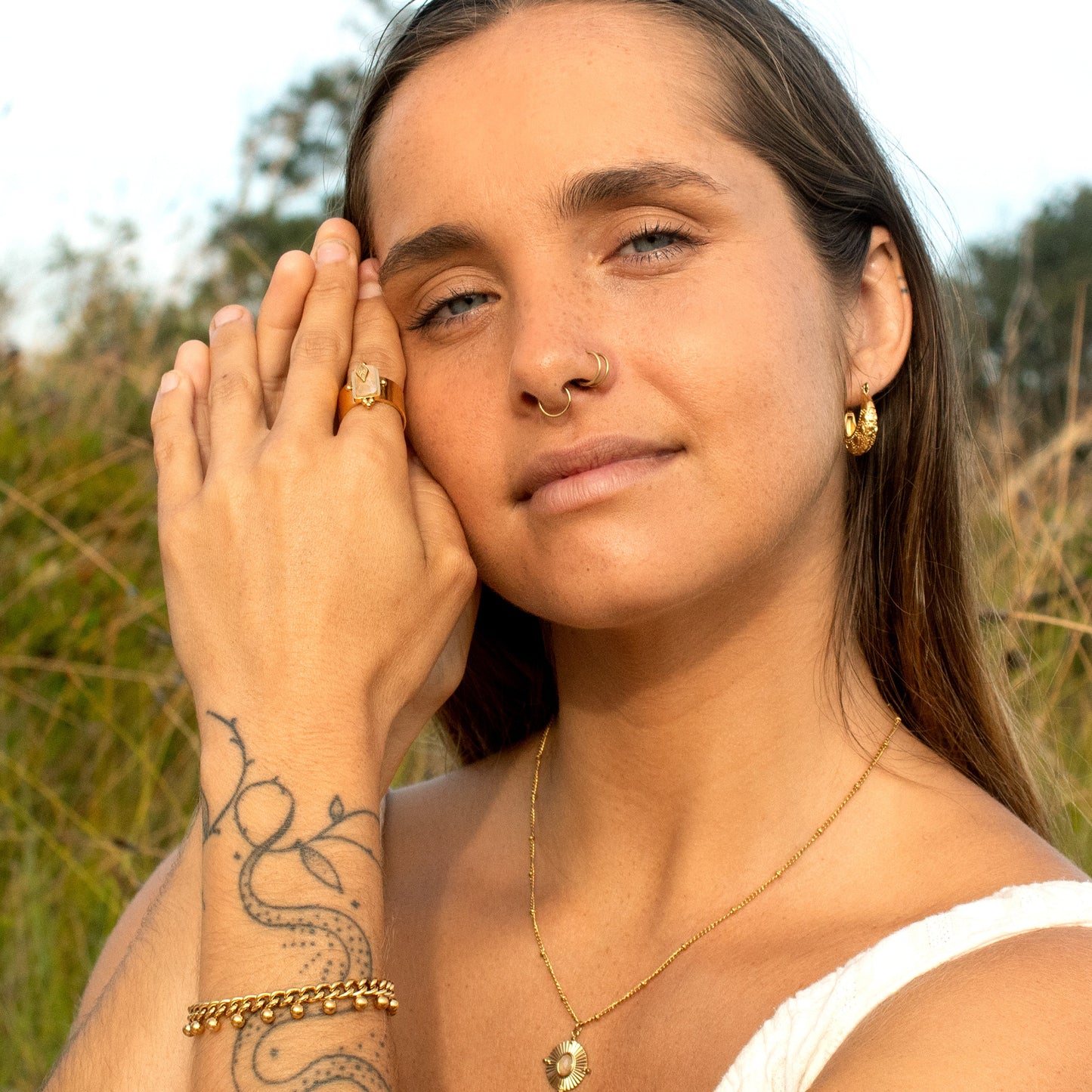 Gold beaded bracelet with charms