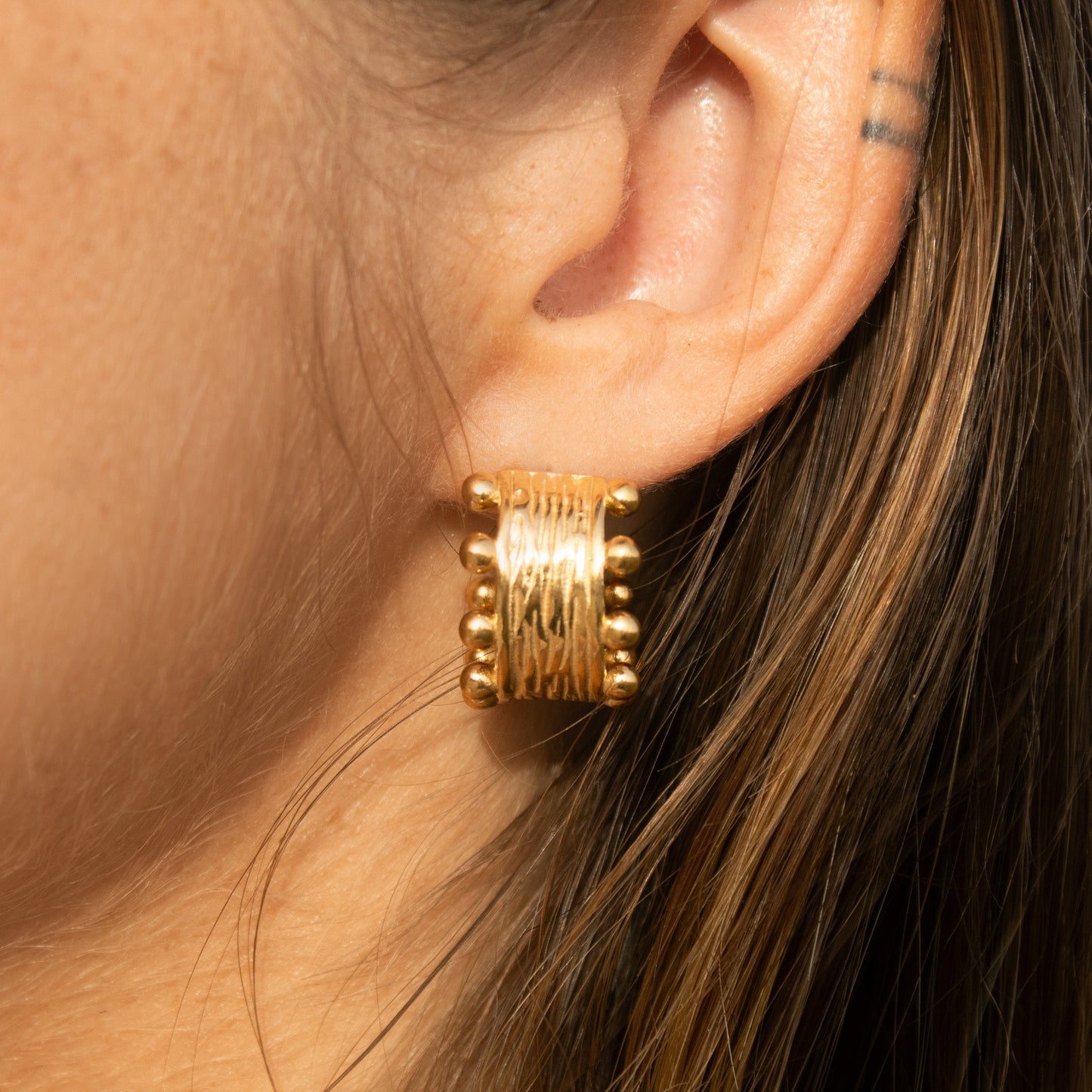 Gold textured hoop earrings
