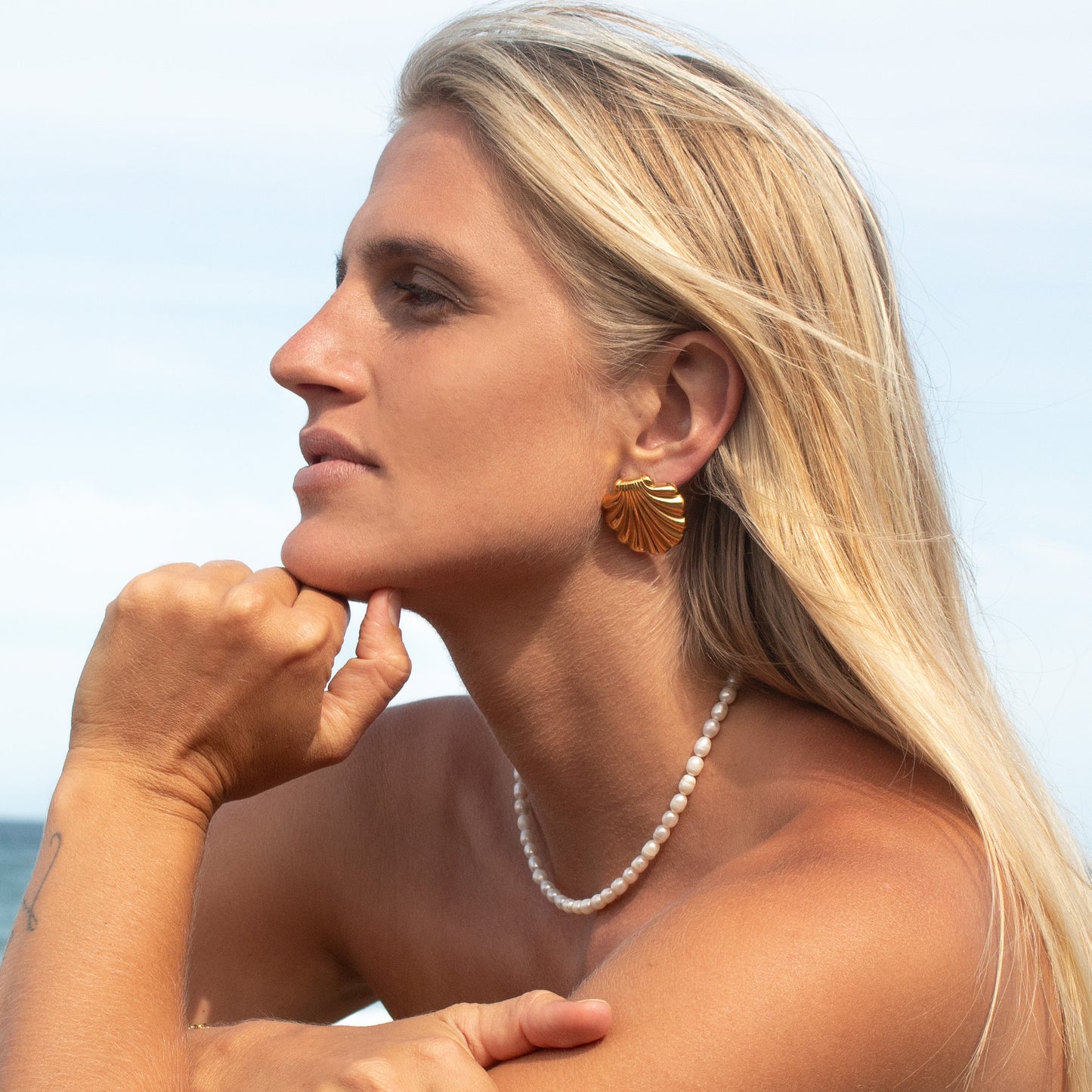 Gold clam shell earrings