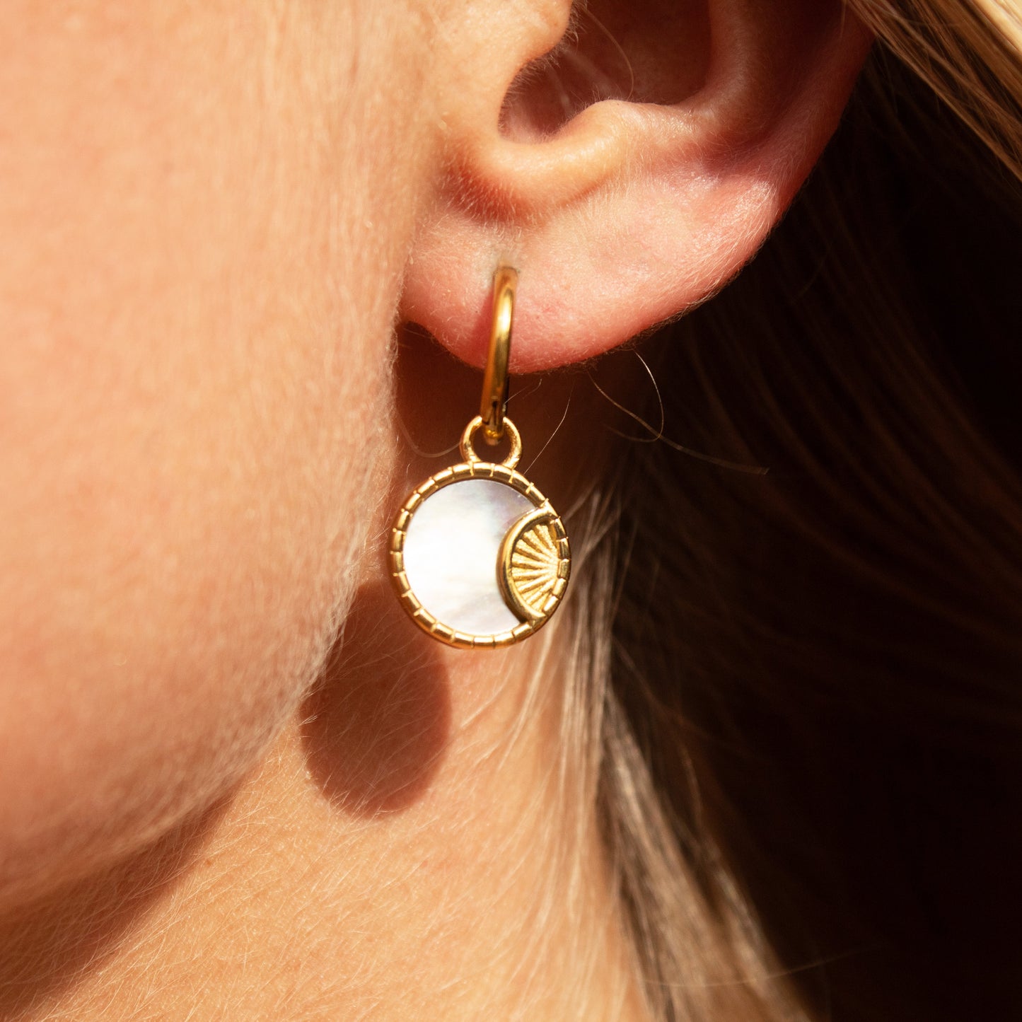 Gold mother of pearl sun earrings