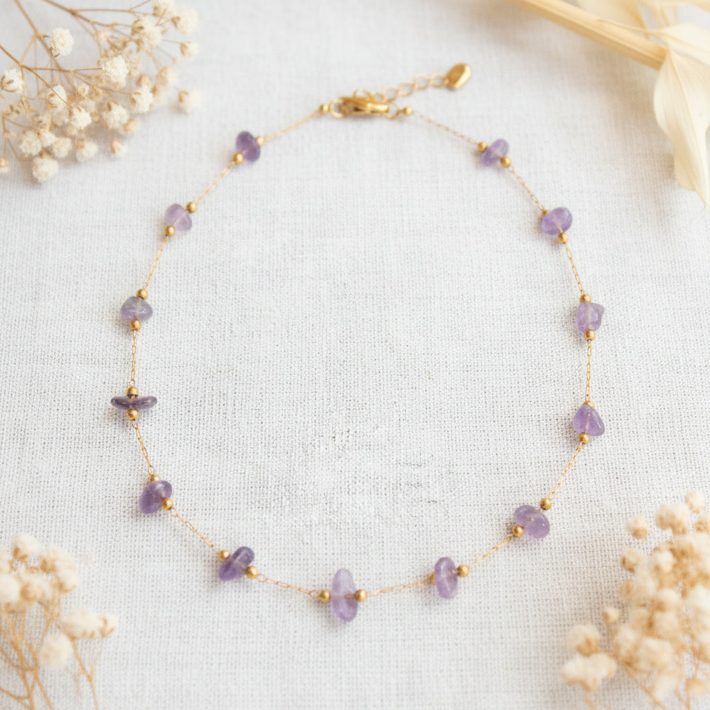 Gold chain bracelet with small purple amethyst stones