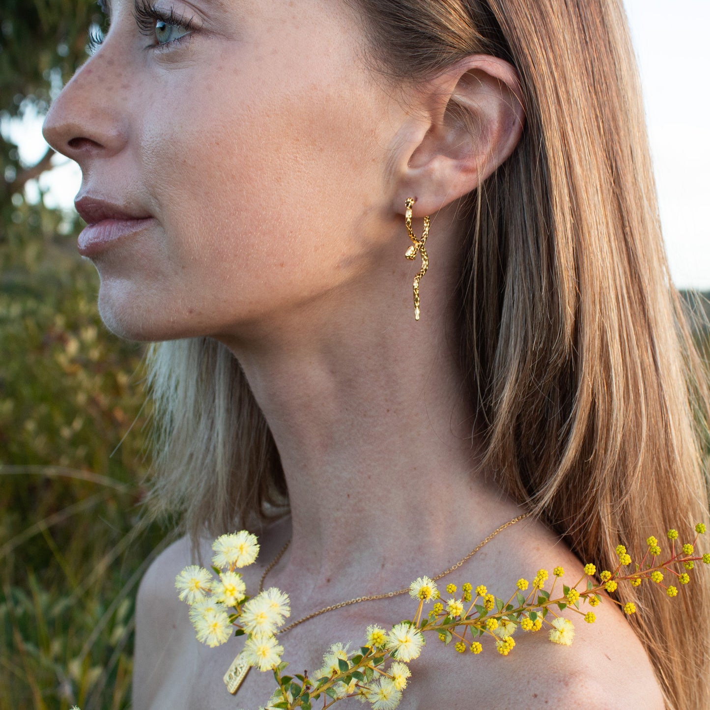 Ananta Serpent gold earrings with diamonds