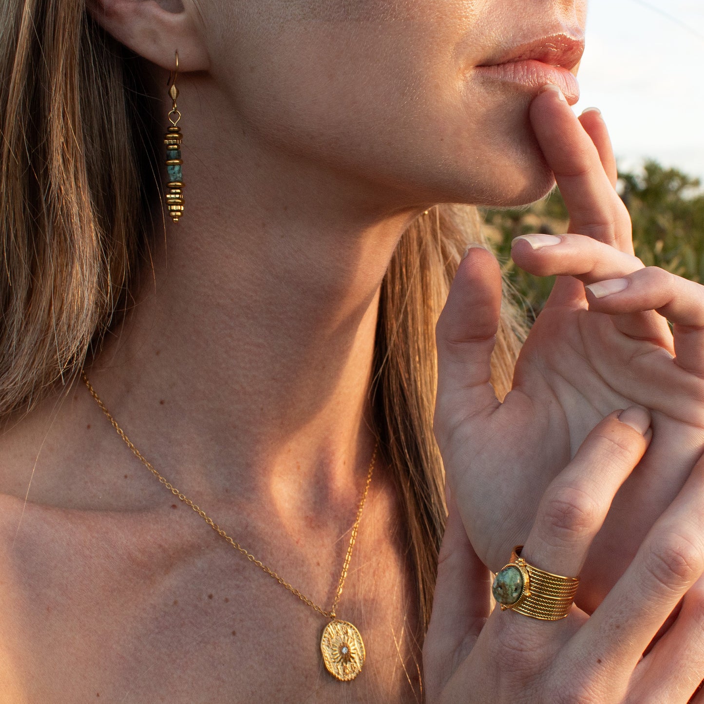 Gold earrings with turquoise beads and gold accents