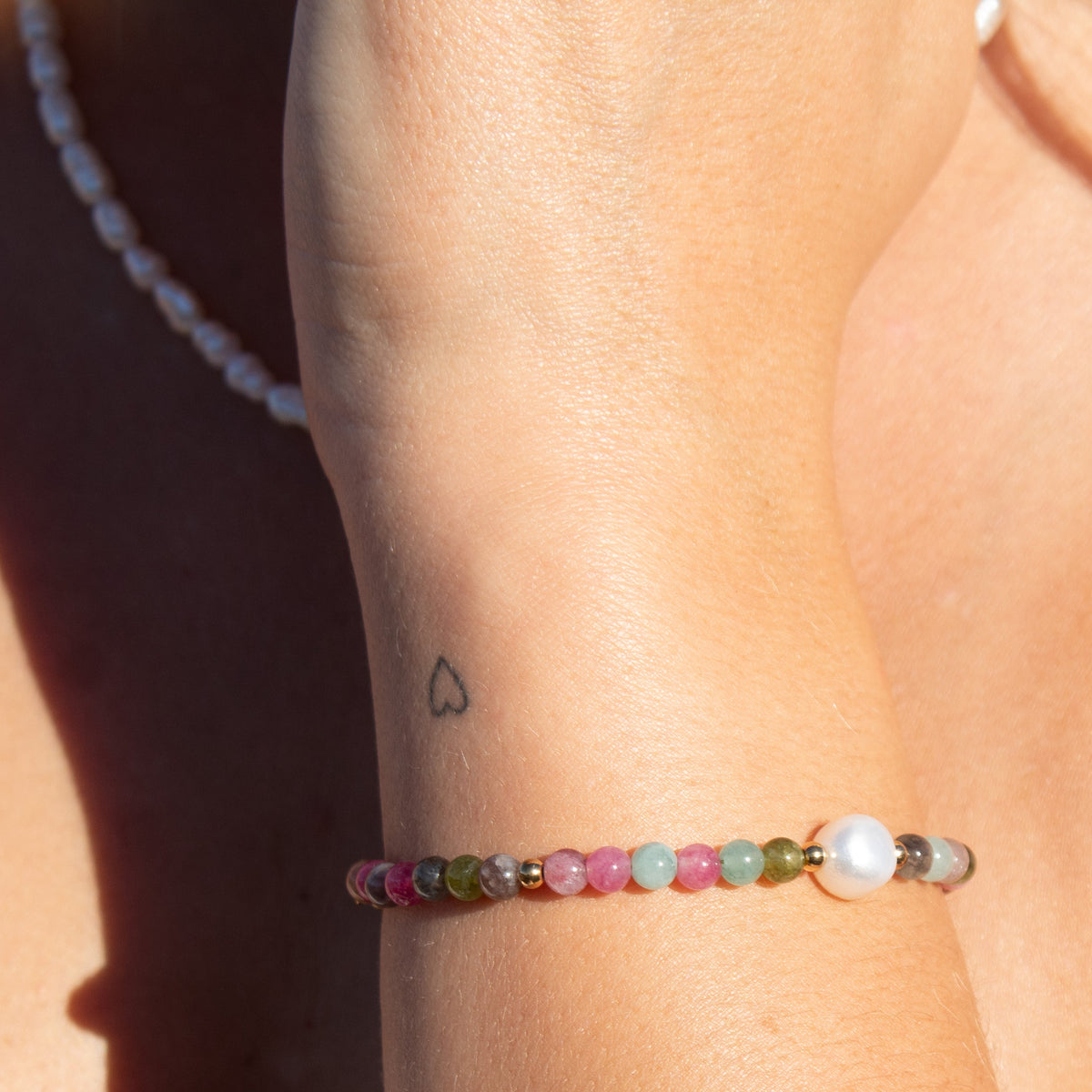 Rainbow beaded bracelet with pearl accent