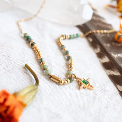 Emerald star necklace with gold beads