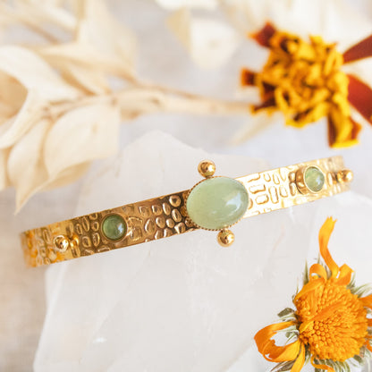 Gold bangle with green jade stones