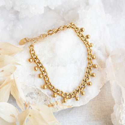 Gold chain bracelet with dangling beads