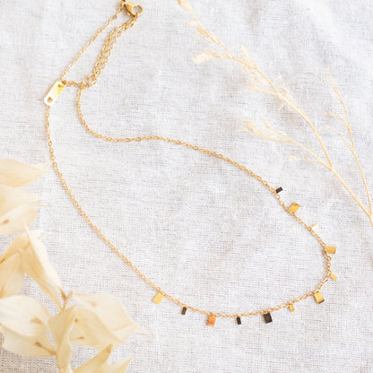 Gold delicate necklace with scattered square charms