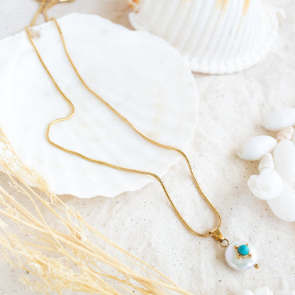 Gold chain necklace with pearl and turquoise pendant