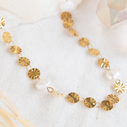 Gold disc and pearl necklace