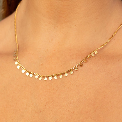 Gold necklace with dangling discs