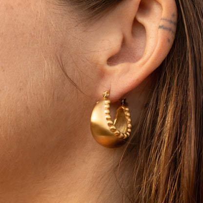 Gold hoop earrings with beaded detail