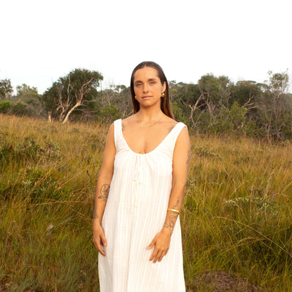 Woman in white dress in a field