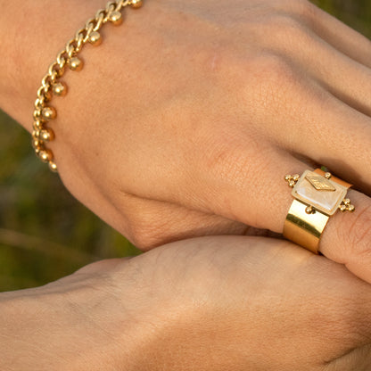 Gold bracelet with bead accents