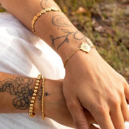 Gold bracelet with star charm