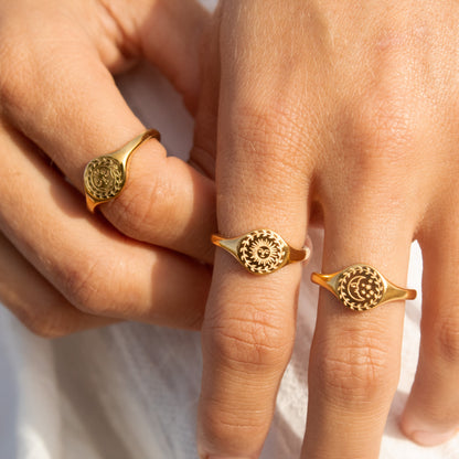 Gold sun and moon signet rings