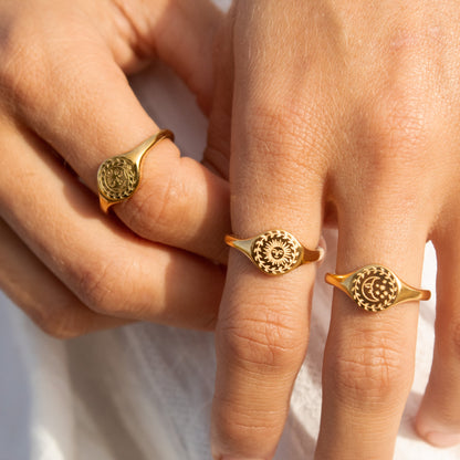 Gold sun and moon signet rings