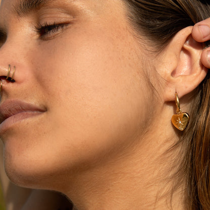 Gold heart earrings with diamond accent