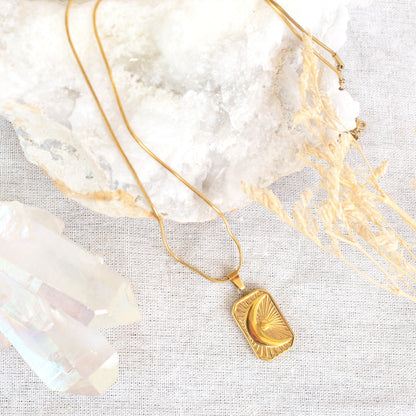 Gold celestial moon and sun pendant necklace