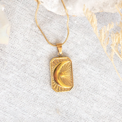 Gold celestial moon and sun pendant necklace