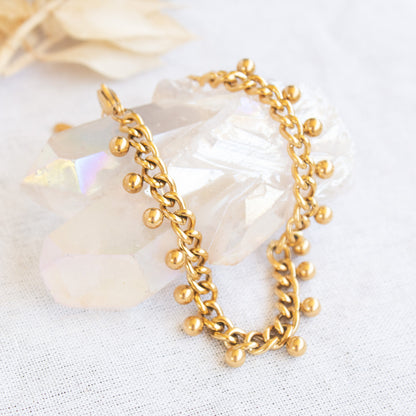 Gold chain bracelet with dangling beads