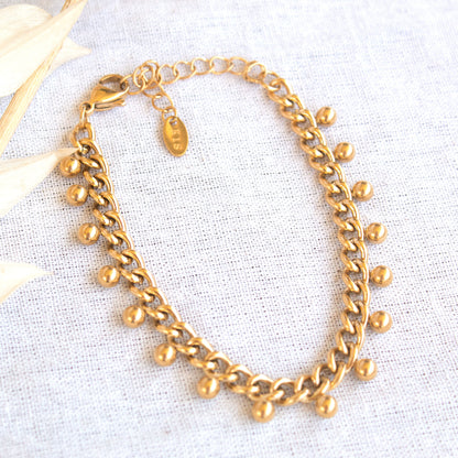 Gold chain bracelet with dangling beads