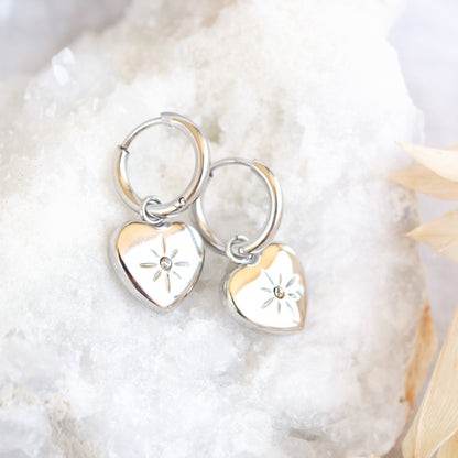 Silver heart hoop earrings with starburst detail