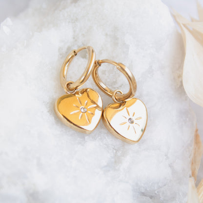 Gold heart earrings with starburst detail