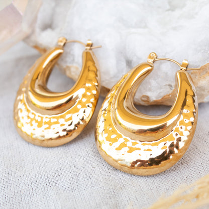 Gold textured oval hoop earrings