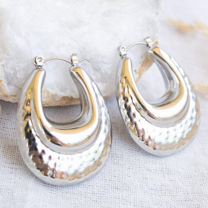 Silver hammered oval hoop earrings