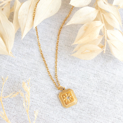 Gold Solara necklace with sunburst pendant
