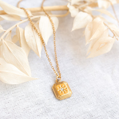 Gold Solara necklace with sunburst pendant