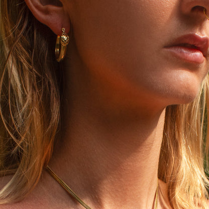 Ouroboros snake hoop earrings in gold