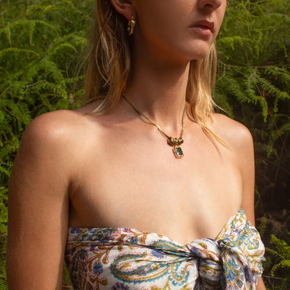 Gold necklace with green stone pendant
