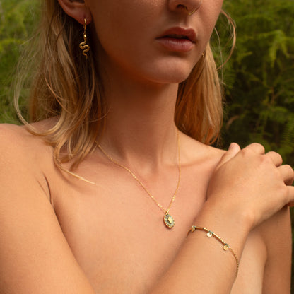 Gold bracelet with charms and beads