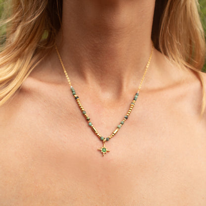 Gold necklace with emerald star pendant