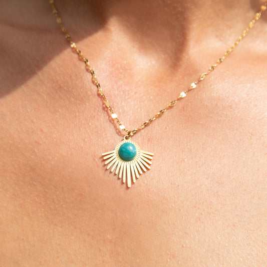 Gold sunburst necklace with turquoise stone