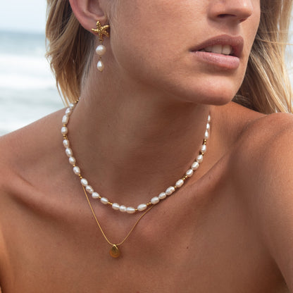 Gold starfish pearl earrings