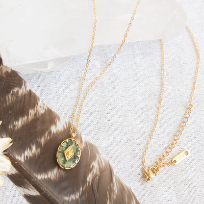 Gold necklace with oval green jade pendant
