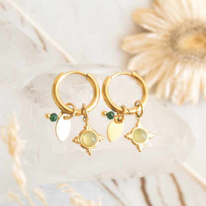 Gold hoop earrings with green stone and star charm