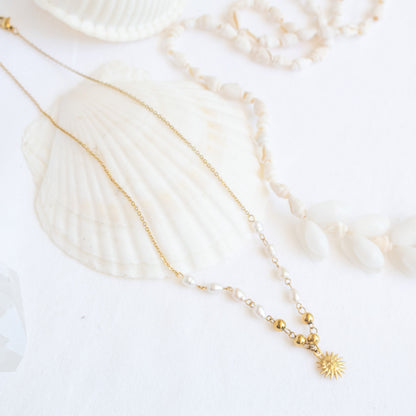 Gold sun charm pearl necklace