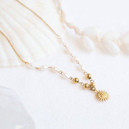 Gold sun pendant pearl necklace