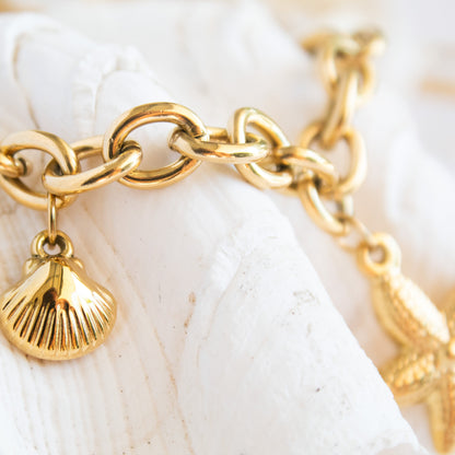 Gold Ocean Spell charm bracelet with seashell
