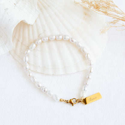 Pearl bracelet with 'Love' charm