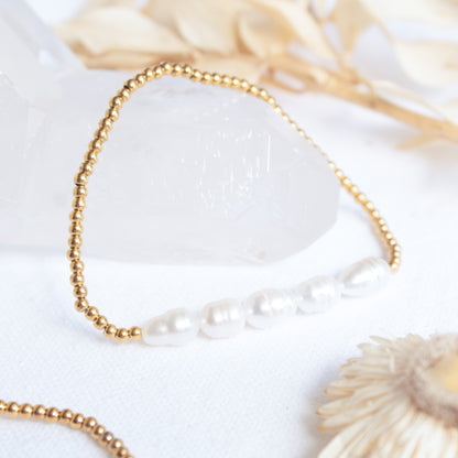Gold beaded bracelet with five baroque pearls