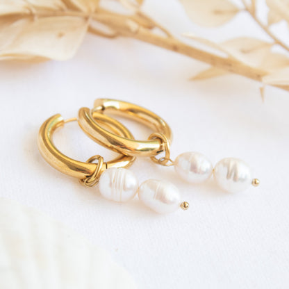 Gold hoop earrings with pearl drops