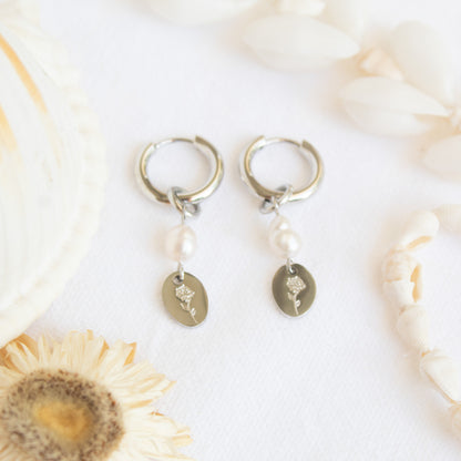 Silver hoop earrings with pearl and flower charm