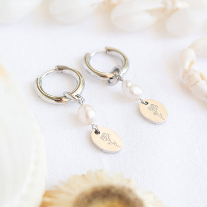 Silver hoop earrings with pearl and flower charm