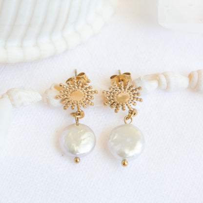 Gold sunburst earrings with baroque pearls